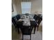 Elegant dining room featuring a set table, neutral decor, and natural lighting at 8923 Cuban Palm Rd, Kissimmee, FL 34747