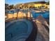 Close up of the hot tub at community pool with steps and stonework at 8923 Cuban Palm Rd, Kissimmee, FL 34747
