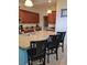 Spacious kitchen features a large island with granite countertops and barstool seating at 8923 Cuban Palm Rd, Kissimmee, FL 34747
