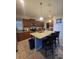 Spacious kitchen boasts granite countertops, dark wood cabinets, and stainless steel appliances at 8923 Cuban Palm Rd, Kissimmee, FL 34747