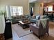 Comfortable living room with a view into the kitchen and sliding glass doors at 8923 Cuban Palm Rd, Kissimmee, FL 34747