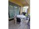 Cozy outdoor patio with a dining table, chairs, and sliding glass doors to indoor living at 8923 Cuban Palm Rd, Kissimmee, FL 34747
