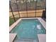 Private in-ground pool with a shallow end and screened enclosure, perfect for relaxation at 8923 Cuban Palm Rd, Kissimmee, FL 34747