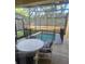 Relaxing screened-in pool area with comfortable seating for outdoor enjoyment at 8923 Cuban Palm Rd, Kissimmee, FL 34747