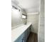 Modern bathroom featuring a long vanity with a white countertop and gray cabinets at 1400 E Fern Rd, Lakeland, FL 33801