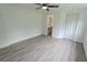Neutral bedroom boasting gray flooring, white walls, and a convenient closet at 1400 E Fern Rd, Lakeland, FL 33801