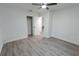 Cozy bedroom showcasing gray flooring, a closet, and freshly painted white walls at 1400 E Fern Rd, Lakeland, FL 33801