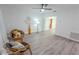 Bright, airy living room features modern ceiling fan and wood-look laminate floors at 1400 E Fern Rd, Lakeland, FL 33801