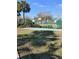 Community basketball court behind a green fence at 7607 Benji Ridge Trl, Kissimmee, FL 34747