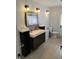 Bright bathroom featuring a double sink vanity with stylish fixtures and ample storage at 7607 Benji Ridge Trl, Kissimmee, FL 34747