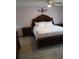 Spacious bedroom featuring an ornate wooden bed frame and matching nightstands at 7607 Benji Ridge Trl, Kissimmee, FL 34747