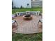 Brick fire pit with seating area for outdoor gatherings at 7607 Benji Ridge Trl, Kissimmee, FL 34747