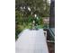 Landscaped patio with colorful flowers and garden decorations at 7607 Benji Ridge Trl, Kissimmee, FL 34747