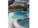 Screened-in pool with lounge chairs at 7607 Benji Ridge Trl, Kissimmee, FL 34747