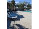 Relax by the community pool with ample lounge chairs for soaking up the sun at 7607 Benji Ridge Trl, Kissimmee, FL 34747