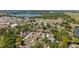 Aerial view of the home in a neighborhood with mature trees, lakes, and downtown in the background at 1048 W Lime St, Lakeland, FL 33815