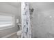 Elegant bathroom with a stand-alone shower and natural lighting at 1048 W Lime St, Lakeland, FL 33815