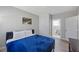 Cozy bedroom with a comfortable bed, smooth gray walls and private bathroom at 1048 W Lime St, Lakeland, FL 33815