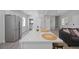 Open living space with a breakfast bar, stainless fridge, and modern decor at 1048 W Lime St, Lakeland, FL 33815