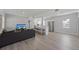 Spacious living area featuring modern furnishings, a kitchen island, and hardwood floors at 1048 W Lime St, Lakeland, FL 33815