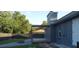 Cozy backyard featuring a pergola, fire pit, and well-maintained landscaping for outdoor enjoyment at 4041 Se 20Th Ct, Ocala, FL 34480