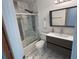 Modern bathroom featuring a glass-enclosed shower with modern fixtures and a vanity with a sleek countertop at 4041 Se 20Th Ct, Ocala, FL 34480