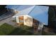 Bird's eye view of the home's blue metal roof, modern stone facade, and meticulously maintained landscaping at 4041 Se 20Th Ct, Ocala, FL 34480
