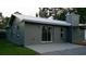 Home exterior featuring a patio, well-maintained lawn, a new roof, and neutral grey paint at 4041 Se 20Th Ct, Ocala, FL 34480