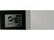 Image featuring a black safe with a key inside, secured to the surrounding wall at 4041 Se 20Th Ct, Ocala, FL 34480