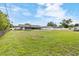 Large backyard with green grass, trampoline, fence, and plenty of space for outdoor activities at 5324 Messina, Lakeland, FL 33813