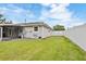 Well-maintained backyard with green grass, a white fence, and space for entertaining at 5324 Messina, Lakeland, FL 33813