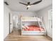 bedroom featuring a bunk bed, ceiling fan, and light-colored walls and floors at 5324 Messina, Lakeland, FL 33813