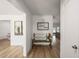 Inviting entryway with a bench, stylish decor, and beautiful wood-look flooring at 5324 Messina, Lakeland, FL 33813