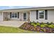 Close up on the entry way of this single Gathering home with beautiful and decorative front yard landscaping at 5324 Messina, Lakeland, FL 33813