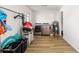 Spacious laundry room with washer and dryer, storage racks, and a large storage area at 5324 Messina, Lakeland, FL 33813