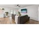 Modern living room showcasing a comfortable sofa, large TV, and bright lighting at 5324 Messina, Lakeland, FL 33813