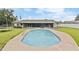 Sparkling pool in a large backyard with a covered patio and lush landscaping at 5324 Messina, Lakeland, FL 33813