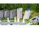 Aerial view of homes with pools in a lush neighborhood setting at 643 Blenheim Loop, Winter Springs, FL 32708