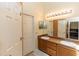 Bathroom featuring double sinks, a large mirror, and neutral walls at 643 Blenheim Loop, Winter Springs, FL 32708