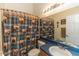 Bathroom with a mirror, blue countertop, vanity and decorative shower curtain at 643 Blenheim Loop, Winter Springs, FL 32708