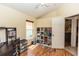 Bright bedroom with a shelving unit by the entry door at 643 Blenheim Loop, Winter Springs, FL 32708