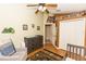 Neutral Bedroom featuring a crib, chair, changer, and plush animal decor at 643 Blenheim Loop, Winter Springs, FL 32708