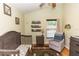 Charming Bedroom with grey wood crib, chair, and neutral decor at 643 Blenheim Loop, Winter Springs, FL 32708