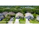Aerial view of houses showcasing manicured lawns and mature trees at 643 Blenheim Loop, Winter Springs, FL 32708