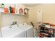 Laundry room featuring white washer and dryer and wire shelving at 643 Blenheim Loop, Winter Springs, FL 32708
