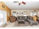 Comfortable living room features neutral colors, tile flooring, access to patio, and lots of light at 643 Blenheim Loop, Winter Springs, FL 32708