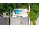 Aerial view of private pool and backyard with patio area and lush landscaping at 643 Blenheim Loop, Winter Springs, FL 32708