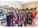 Walk-in closet with metal racking providing plenty of storage for clothing and accessories at 643 Blenheim Loop, Winter Springs, FL 32708