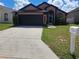 Beautiful single-story home featuring a spacious driveway and well-maintained front lawn and mailbox at 506 Nicholson Dr, Davenport, FL 33837