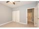 Bedroom with light gray walls, closet, fan and attached bathroom at 946 15Th St # 202, Daytona Beach, FL 32117